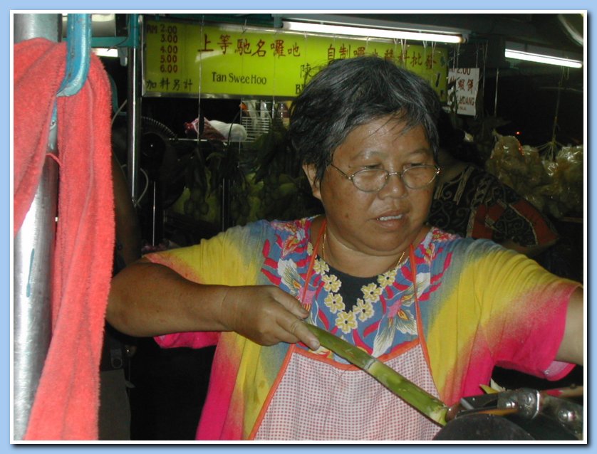 Lady making sugar cane water